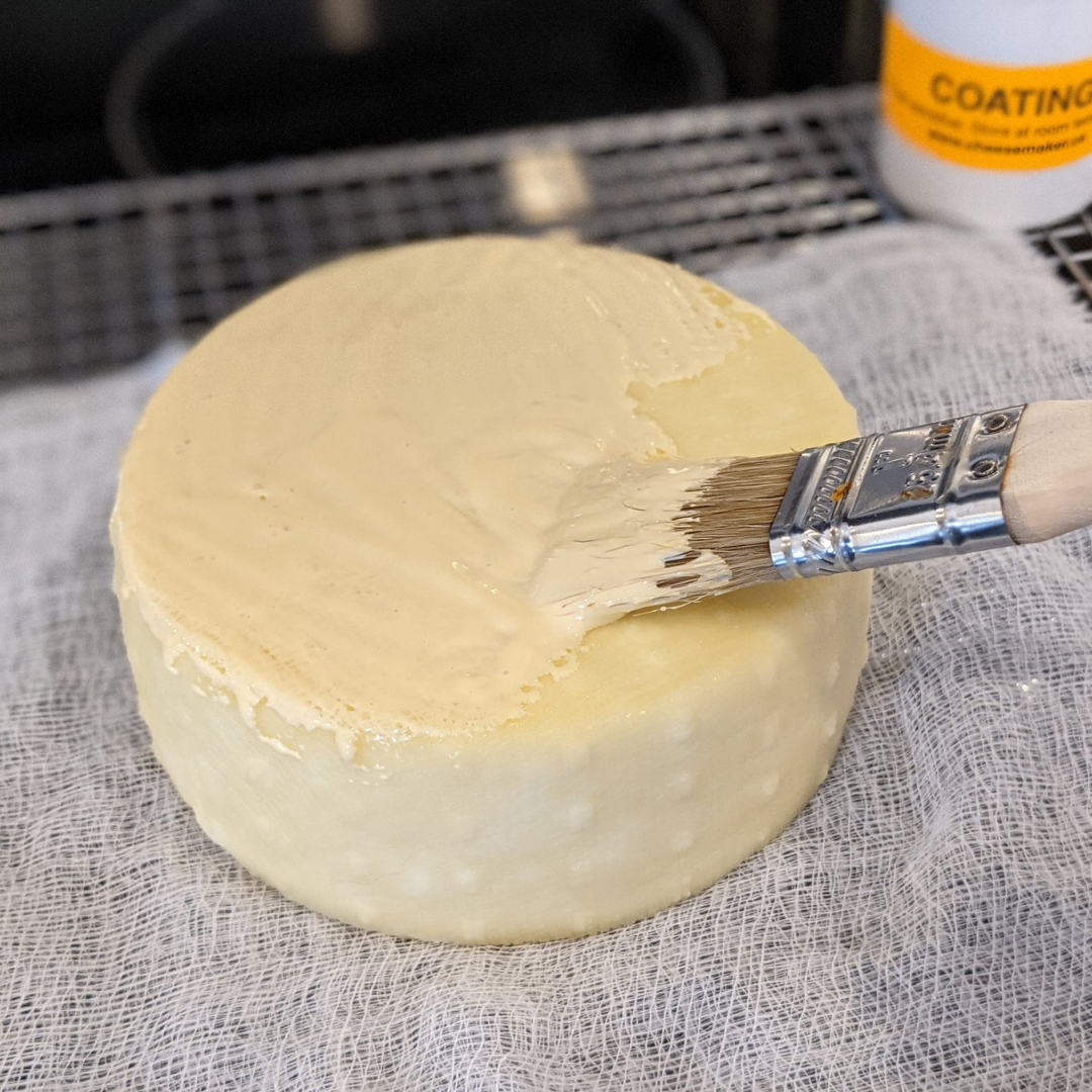 Waxing Cheddar for Aging